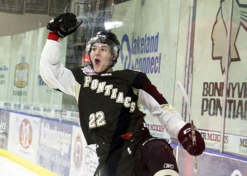 Adam Sandstrom celebrates his goal during the Pontiacs game against Whitecourt.