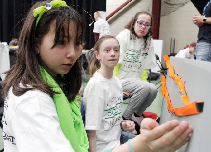  These Aurora Middle School students put their marble rollercoaster to the test during the second challenge of the day.