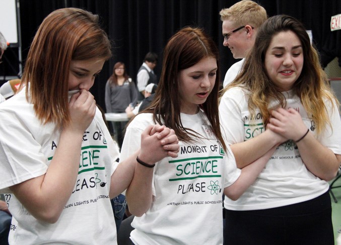  The Grade 9 BCHS students wait patiently as the judges take a look at their money bucket.