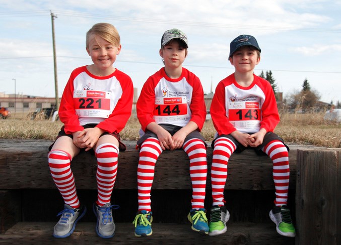  Getting ready for the big race are Scott, Mathys, and Joey who were all taking part in the five-kilometre run.