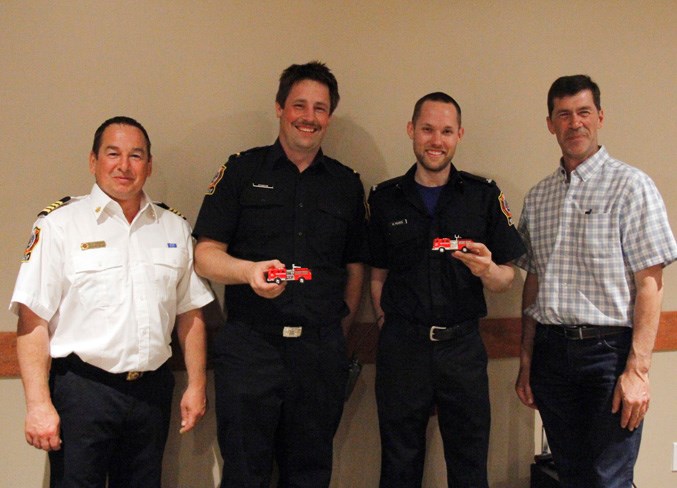  Kelly Turzanski, deputy regional chief and Greg Sawchuk, BRFA board chair, present Colin Atkinson and Matt Pearce with recognition for receiving their Class 2 licences.