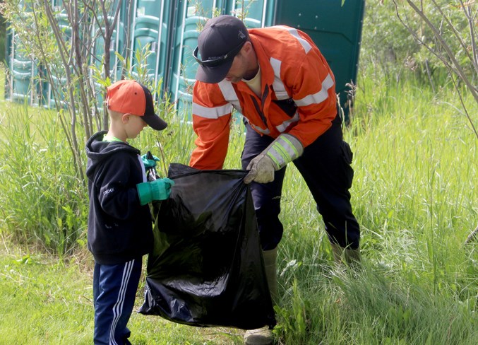 28.local news. Jessie Lake cleanup dad and son