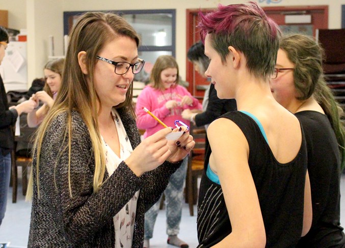  Megan Kwiatkowski (left) asks Emma Fox (right) a question during an icebreaker activity.