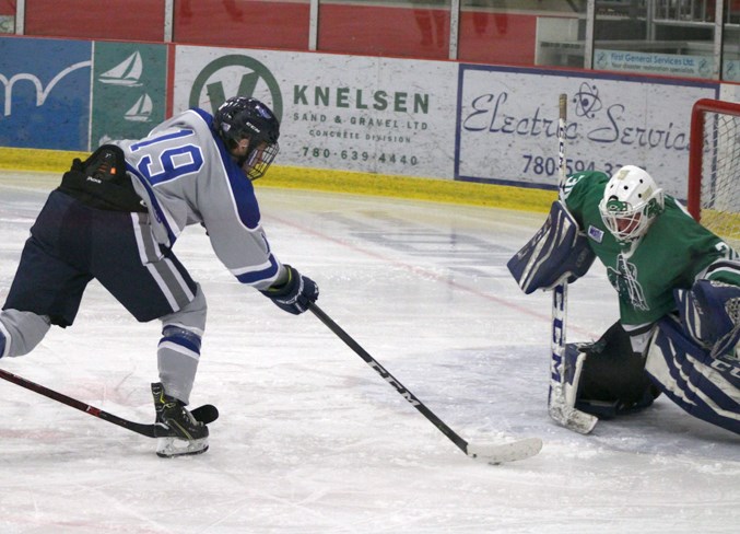  Anson Smith takes a shot on net during the Wings' final game of the showdown on Saturday. Smith recorded his first hat trick of the season versus the Seattle Totems.
