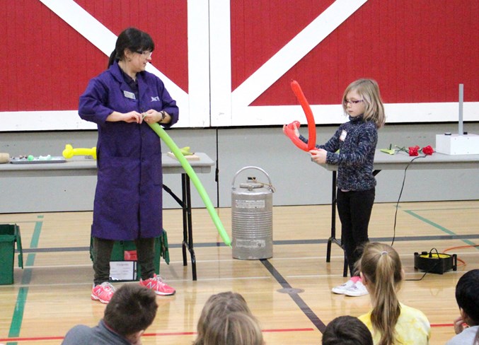  Grade 2 student Emily Earhart (right) shows off her balloon animal making skills to Whitney Horban (left) during one of the presentations on cryogenics presentation.