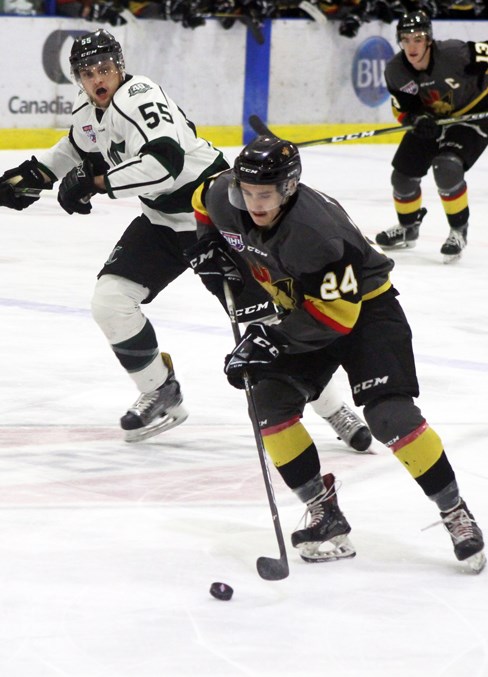  Trey Thomas carries the puck down the ice.