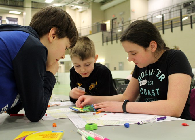  Julien, Easton, and Molly were busy with their challenge.