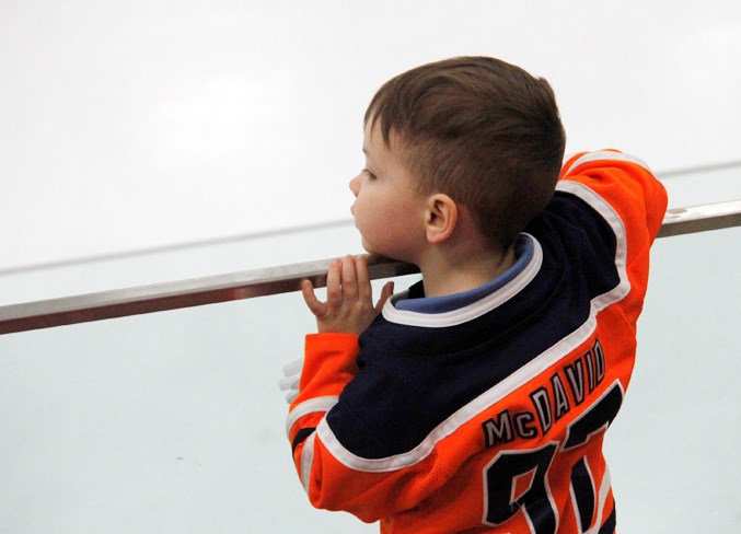  One of the Wings' younger fans watches the game unfold.