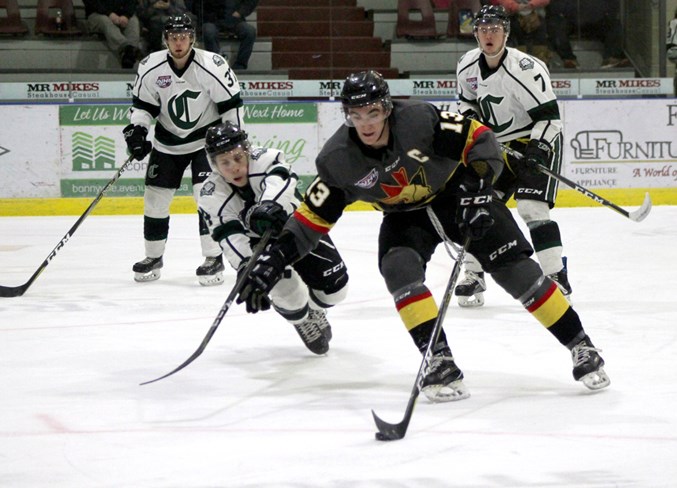  Lucas Reeves fights for control of the puck during the game.