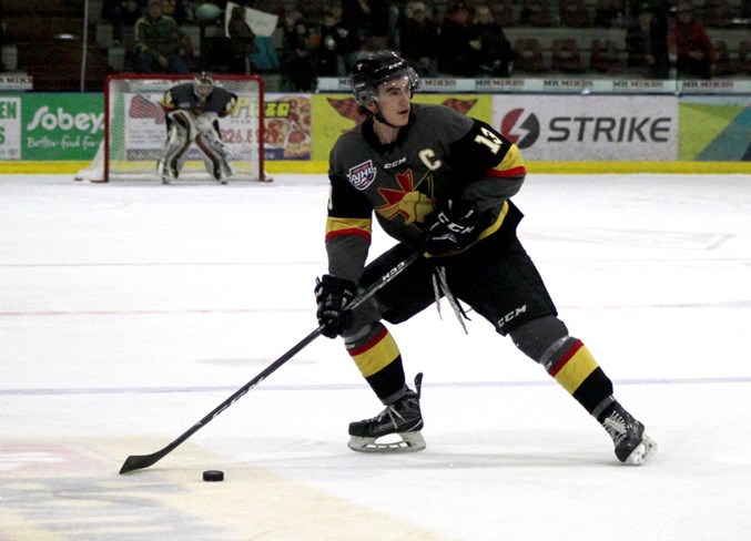  Grayson Constable looks for an open man during the Saturday, March 16 game the Spruce Grove Saints in the best of seven series.