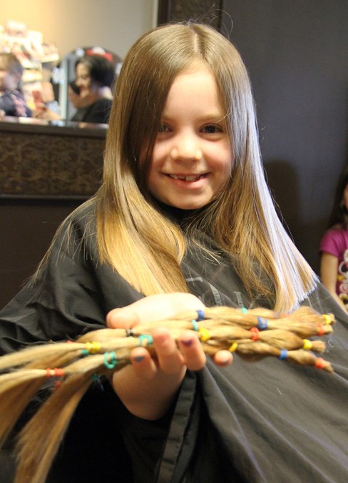  Seven-year-old Solange Desnoyers cut 12-inches off of her hair on Saturday.