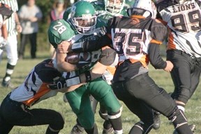 Pacers running back Jessie Snow is swarmed by a group of Lions during the second quarter of Friday night&#8217;s matchup at EPC. The Lions went on to win, 69-20.