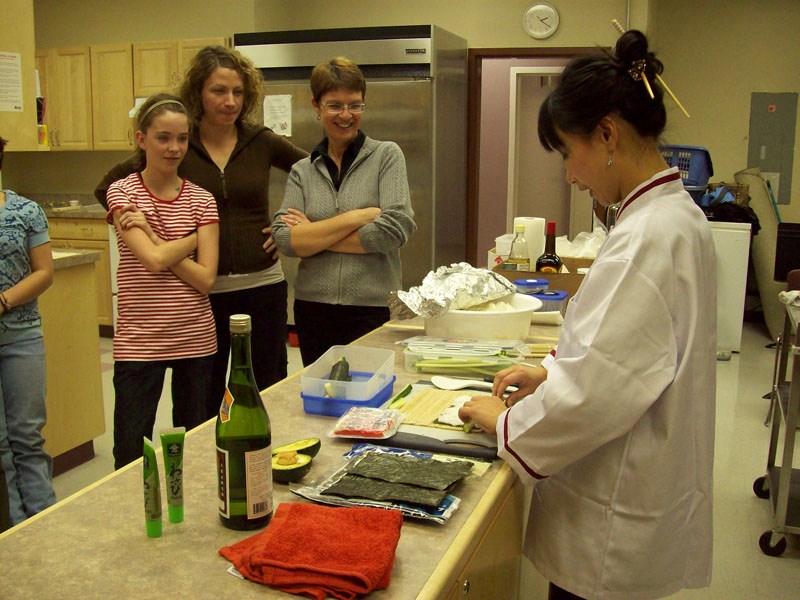 Margarita Chen (at right) demonstrates sushi-making techniques at a class held last year, through the French Canadian Association (ACFA) of St. Paul. Chen will be offering