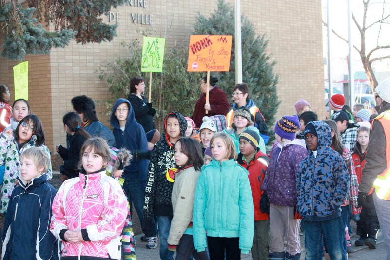 More than 200 people, including children from St. Paul Elementary School, joined a walk on Nov. 2 to raise awareness about family violence.