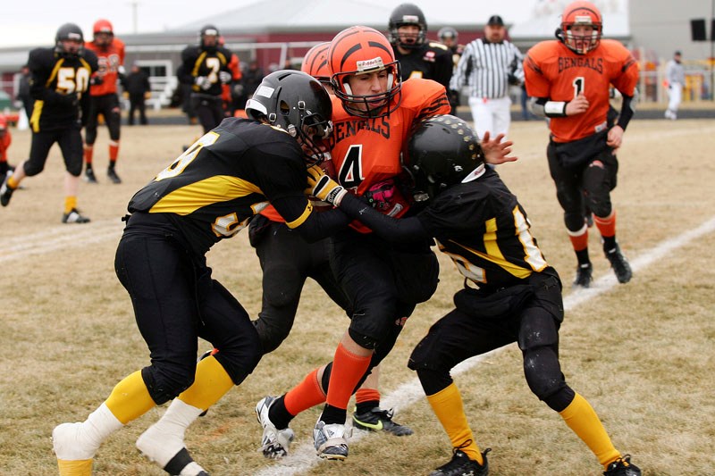 Dmitri Krys (4) is tackled during the second half of the 2010 Bantam Provincials semi-final football game at Regional Field against the Leduc Ti-Cats. The Bengals made