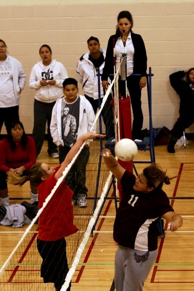 Pictured is action at the nets during one of the games during the indigenous girls&#8217; volleyball tournament at Saddle Lake Kihey Asiniy school on Sunday noon.
