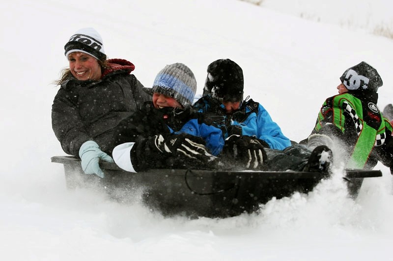 Some enjoyed the winter blast of snow last Wednesday, which let the Racette School students get outside for some tobogganing. Here, teacher Jocelyne Chamberland and students