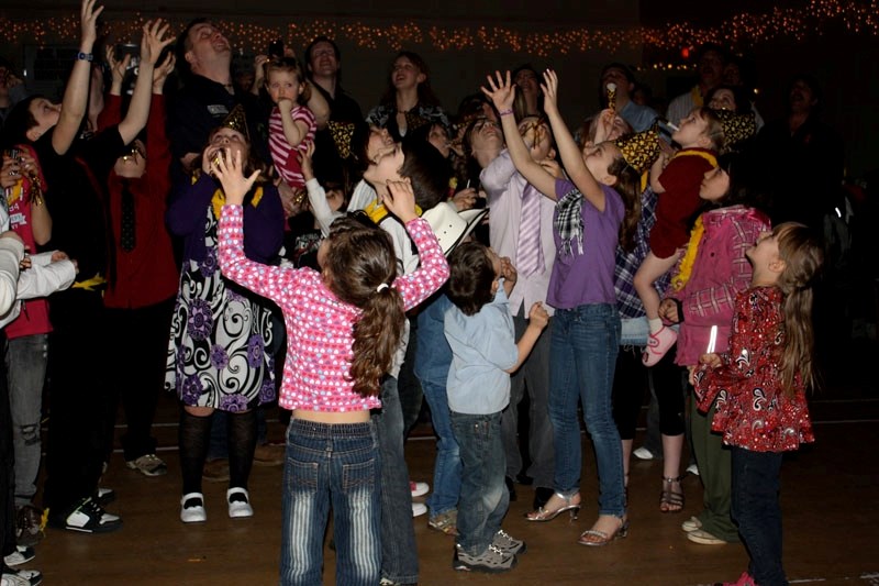 Party-goers cheer the arrival of the New Year at St. Paul&#8217;s New Year&#8217;s Eve Benefit dance.