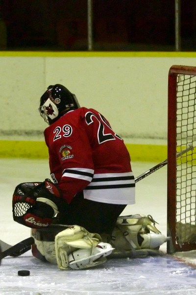 Saddle Lake Warriors&#8217; goalie, Matthew Johnson, tries to stop the puck during a game on Friday at Saddle Lake&#8217;s Manitou Kihew arena. The Warriors lost their game