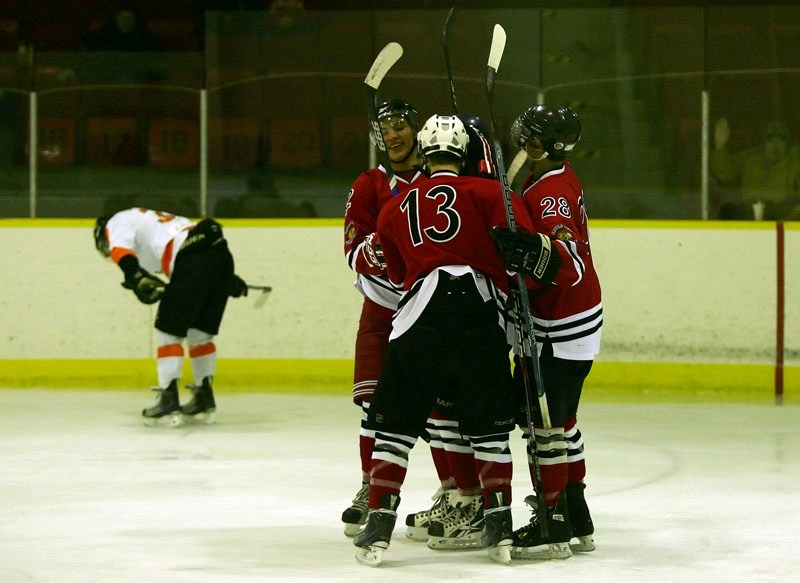 The Saddle Lake Warriors celebrate after Jared Cunningham&#8217;s goal in the first period against the Wainwright Bisons on Friday evening at Saddle Lake. The Bisons won by a 