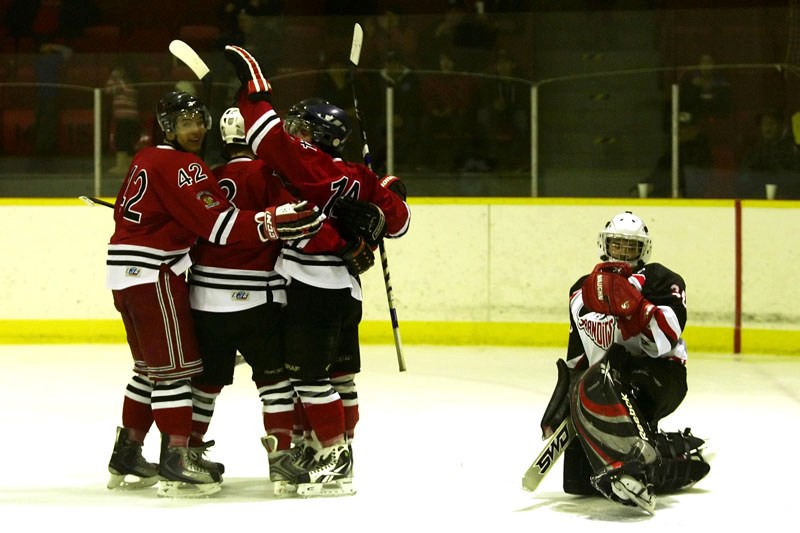 The Saddle Lake Warriors celebrate the team&#8217;s first goal by Warriors&#8217; Jared Cunningham during a playoffs game against the Lloydminster Bandits. The Bandits would