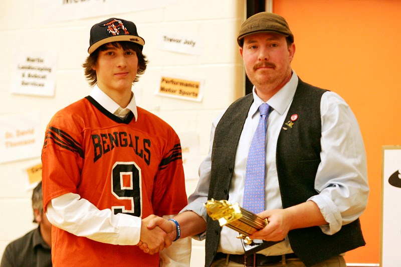 Seth Henderson presents Brenden McKay with the Most Valuable Player award at the Lions and Bengals&#8217; awards banquet, held after the end of the football season last year. 