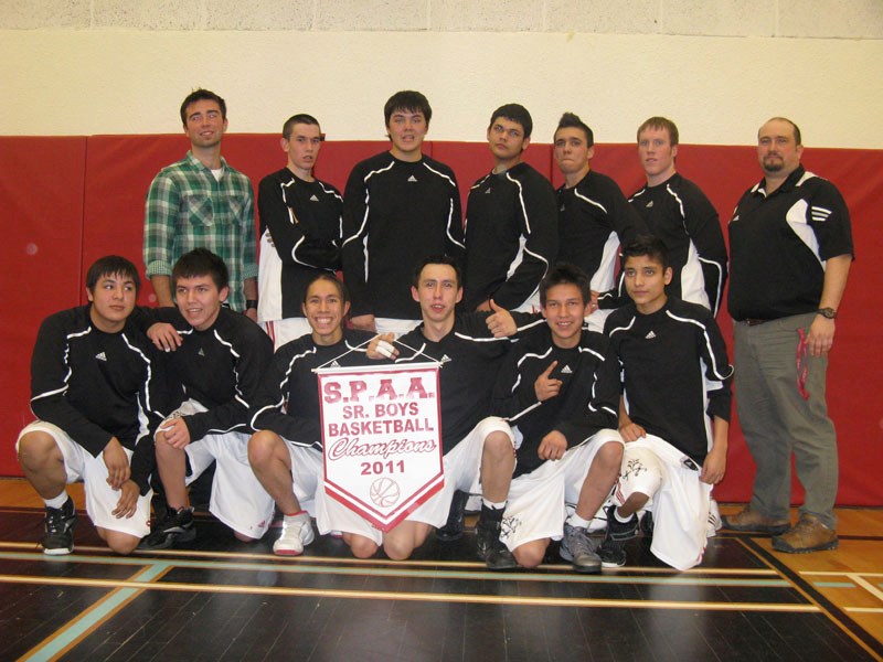 The Ashmont Falcons pose for a team photo after winning the 2011 SPAA Senior Boys&#8217; basketball final game last Wednesday.