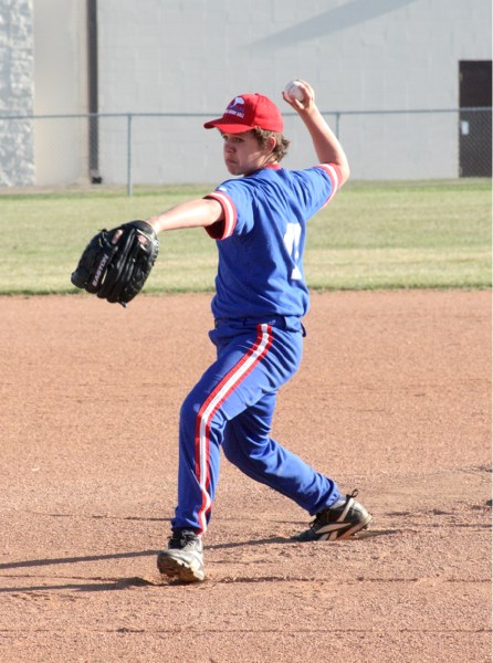 Starting pitcher Tyler Benoit-Hinz for the St. Paul bantam 2 boys team pitches in the first inning against Goodfish on Wednesday. St. Paul won the match 12-10.