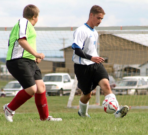 St. Paul U16 boys Dominic Dion moves the ball up the field against Bonnyville during Lakeland Cup action on Saturday.