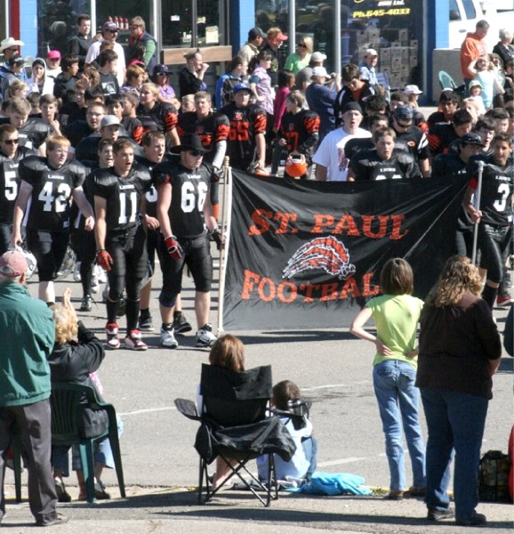 The St. Paul Lions and Bengals march in the &#8216;Go Country&#8217; rodeo parade on Sept. 3.