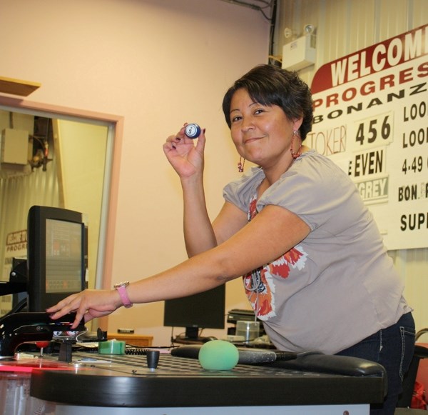 Candace Cardinal calls the last bingo on the last night at the West End Bingo hall on Friday evening.