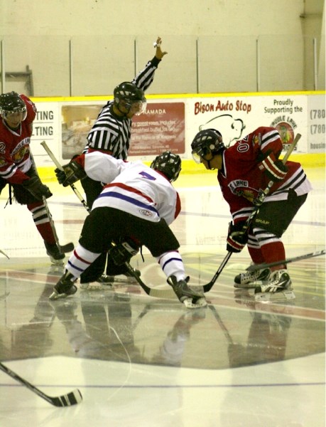 The Canadiens&#8217; Skyler Giroux faces off the first pre-season game against the Warriors&#8217; Jared Cunningham in Saddle Lake on Saturday.