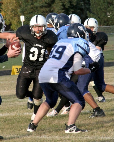 Baxter Bailey lines up the Vortex quarterback at an exhibition game in the Jungle on Tuesday.