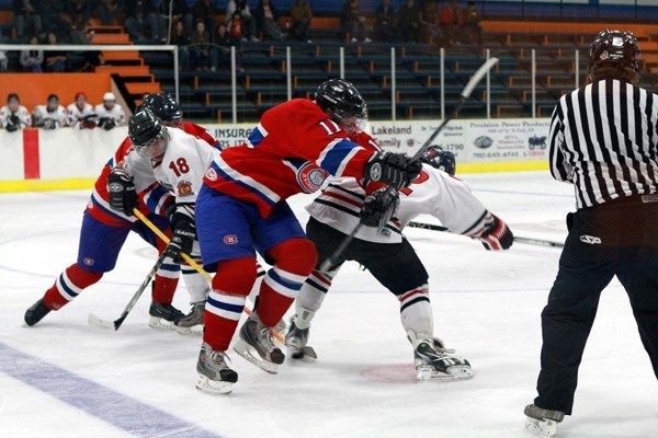 Justin Dubeau (11), Jade Cunningham (18) and others of the Canadiens and Warriors sort out differences after a faceoff at the game on Sept. 27.