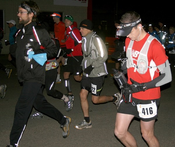 A group of runners departs from the start line at 50 Avenue and 53 Street in St. Paul at the IronHorse Ultra on a crisp Saturday morning with temperatures dipping below zero