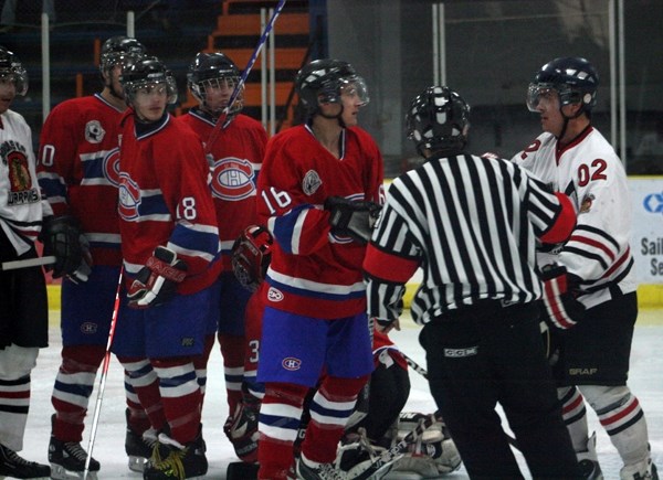 Canadiens&#8217; Brett Blanchette and the Warriors&#8217; Jared Cunningham exchange words at a game in St. Paul on Nov. 12.