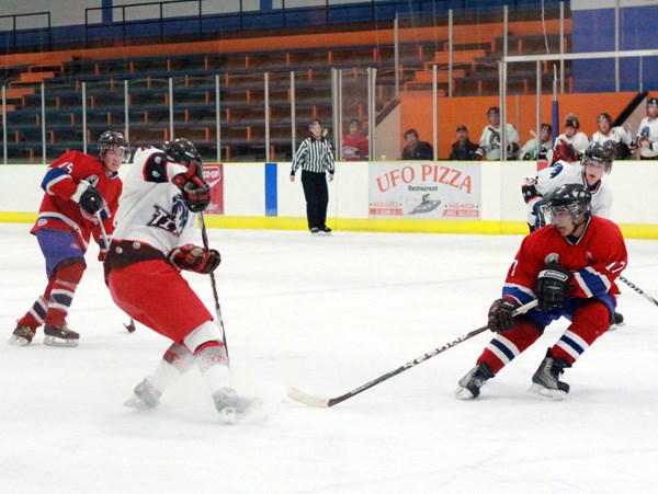 One of the Canadiens&#8217; top point producers, Skyler Giroux, works for the puck in a game against the Titans earlier this season at home.