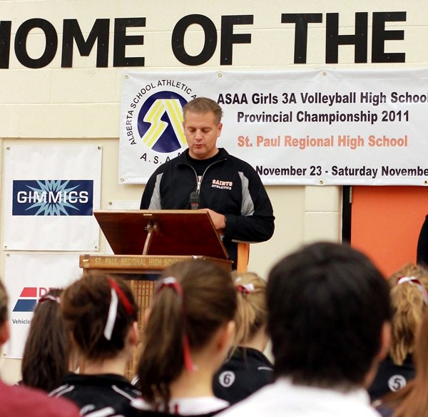 St. Paul Regional High School girls&#8217; volleyball coach Hank Smid reads the coaches&#8217; pledge prior to the start of the ASAA girls volleyball provincials on Thursday