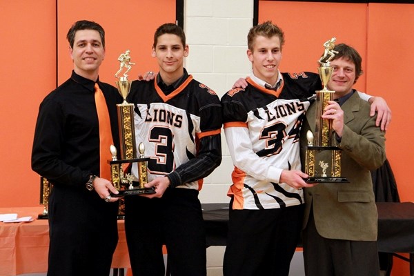 The Lions Most Valuable Player award was handed out to two players this year. (Left) Coach Todd Tanasichuk presents Mark Proskiw with his trophy, while coach John Lumby