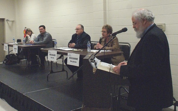 Moderator Marvin Bjornstad presides over the all candidates forum for the Town of St. Paul byelection on Wednesday. From left are candidates Alice Herperger, Norm Noel,