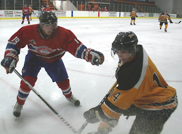 St. Paul&#8217;s Jesse Parenteau lines up Vermilion&#8217;s Chevy Botting in Junior B play Sunday afternoon. The Canadiens lost to the Tigers 12 &#8211; 3.