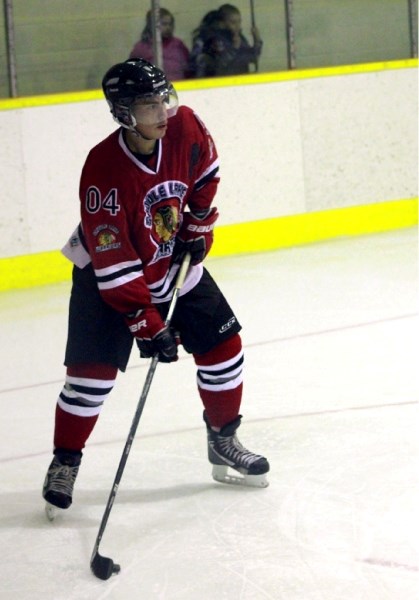 Miles Baptiste plays the puck at a home game earlier this season.