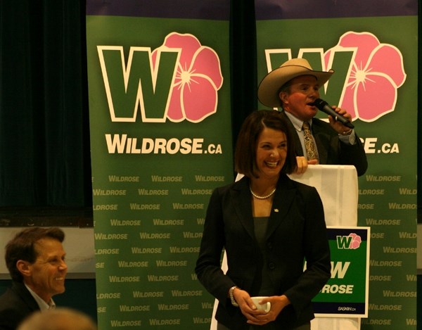 Miles Wowk auctions off Wildrose Party leader Danielle Smith at a fundraiser dinner in St. Paul on Tuesday. Next in line is Wildrose MLA Guy Boutilier.