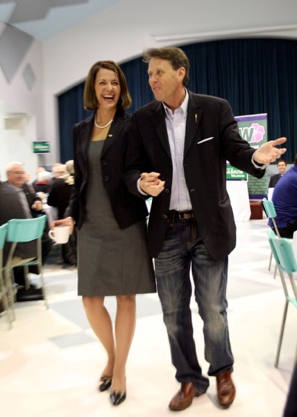 Wildrose MLA Guy Boutilier walks party leader Danielle Smith to her table for dinner, where one attendee paid $3,100 for Smith&#8217;s company in the live auction at a