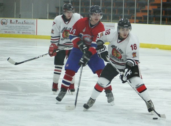 Saddle Lake Warriors&#8217; forward Braedin Makokis-Mcgilvery stick handles past St. Paul Canadiens&#8217; Justin Funk during league play last month. The Warriors finished in 