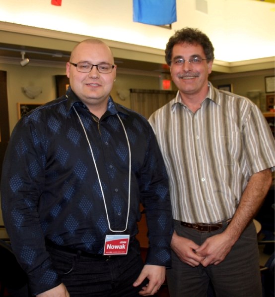 Liberal Party candidate John Nowak (left) and local Liberal association member Amil Shapka met with voters at the St. Paul Legion on Thursday.