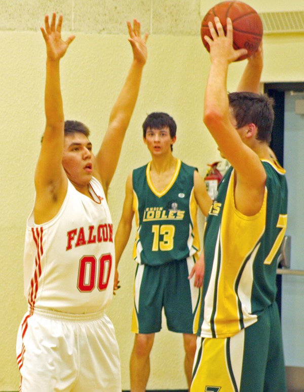 Ashmont&#8217;s Emery Delver looks to block a pass against Glendon in the senior boys SPAA basketball final on Mar. 5. The Falcons won the game 73 &#8211; 69.