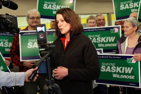 Wildrose leader Danielle Smith brought her campaign tour to the St. Paul Curling Club on Wednesday. Flanked by supporters, Smith discusses election issues with the Journal