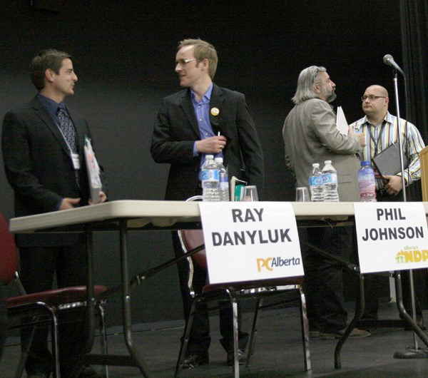 Shayne Saskiw (left), Phil Johnson, Ray Danyluk and John Nowak chat after the forum at the Vilna Cultural Centre on April 10.