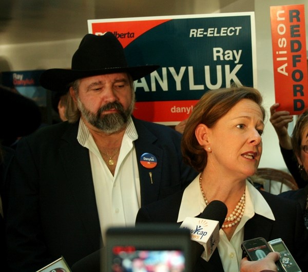 Premier Alison Redford speaks with media after a campaign meet and greet at the Ukrainian Cultural Centre in St. Paul, flanked by Lac La Biche &#8211; St. Paul &#8211; Two
